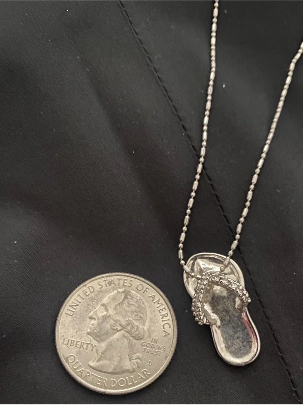 Coach pendant flip